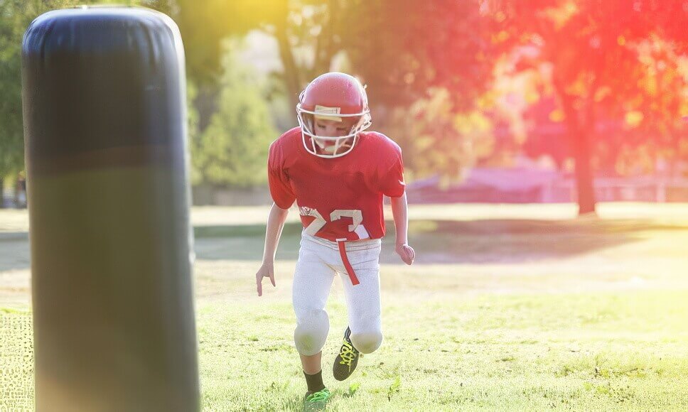 Boy in football gear