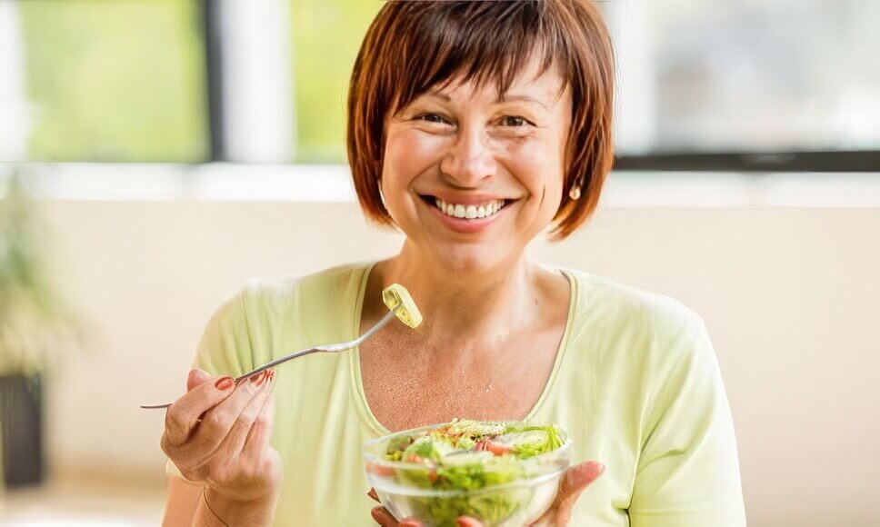 Woman eating healthy salad