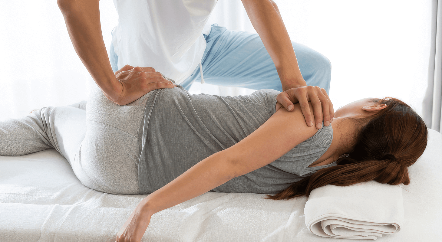 Woman getting a chiropractic adjustment