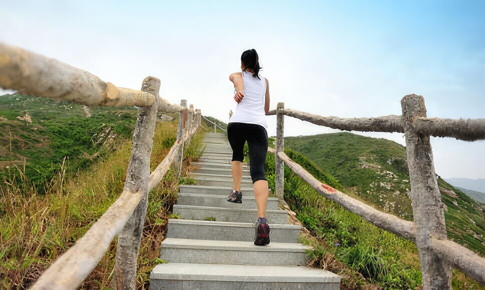 Woman jogging upstairs