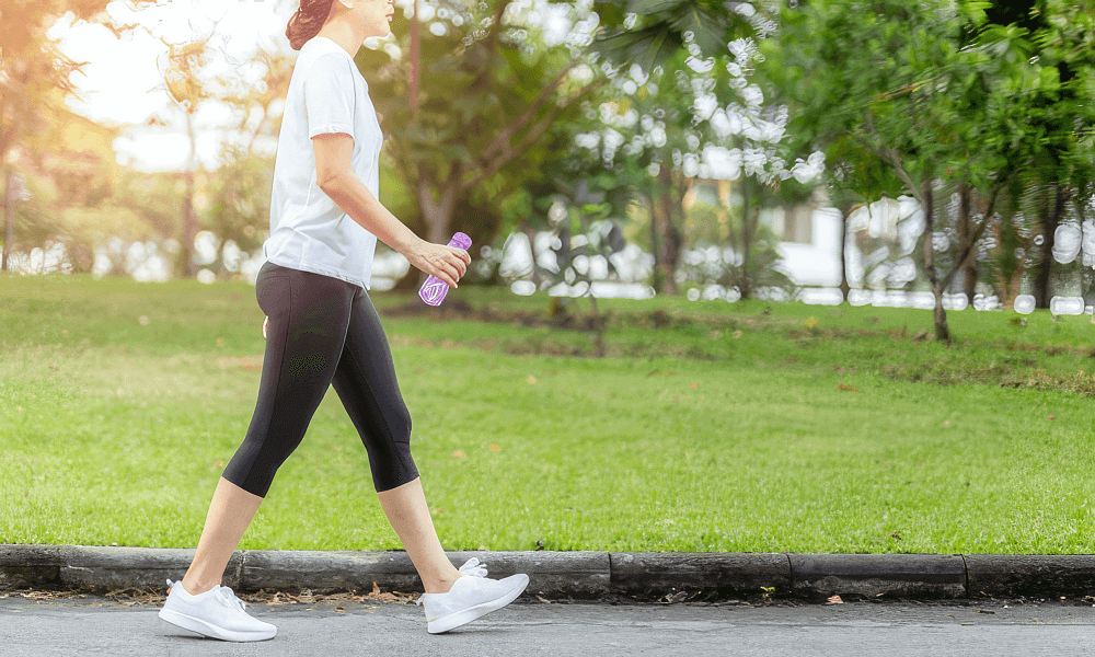 Woman walking through the park